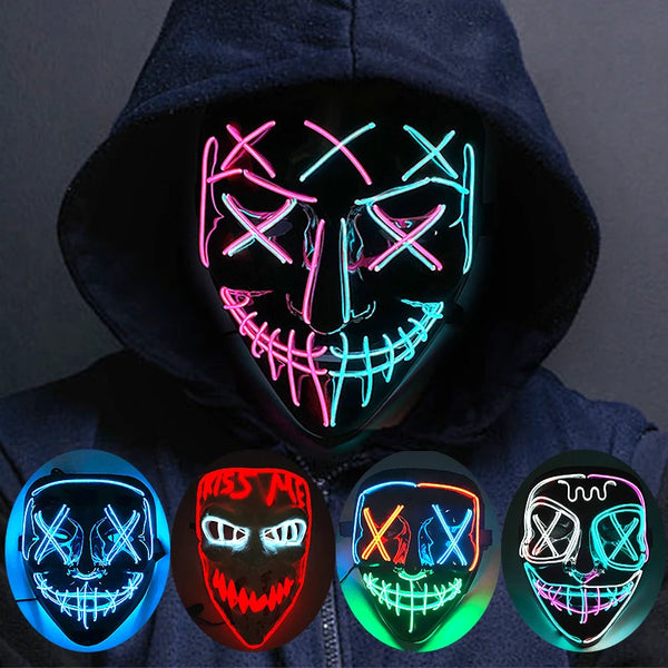 A glow-in-the-dark LED purge mask with neon wire details displayed on a dark hoodie.