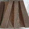 A collection of natural wood blanks for knife handles and DIY projects, showing various grain patterns.