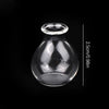 A clear glass vase with a narrow opening and a round base, shown against a black background.