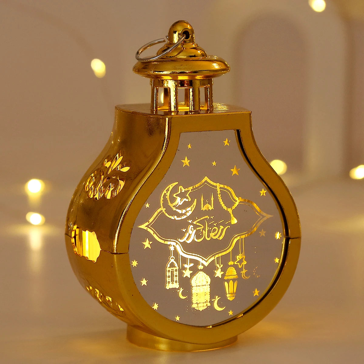 A golden LED star and moon lantern with intricate detailing, illuminated against a soft background.