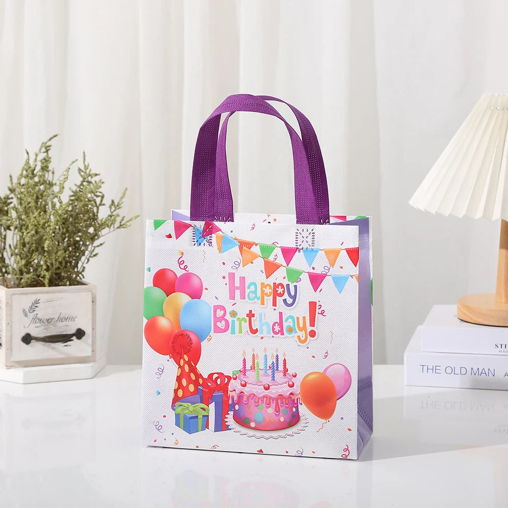 A purple non-woven gift tote bag featuring a colorful birthday theme with festive decorations.
