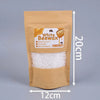 A brown paper bag containing 100g of white beeswax pellets for DIY candle making.