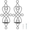 A set of two decorative black iron wall candle sconces with an ornate, swirling design.
