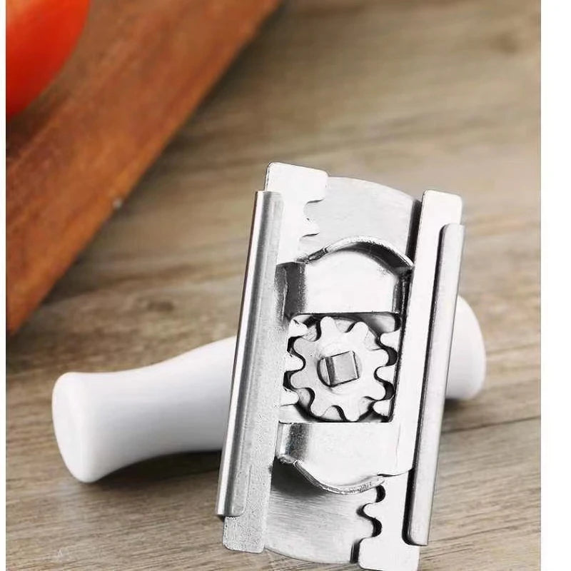 Stainless steel multi-function bottle cap opener with a white handle shown on a wooden surface.