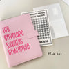 A pink A5 binder for a 100 envelope savings challenge with numbered pockets and a corresponding tracker sheet.