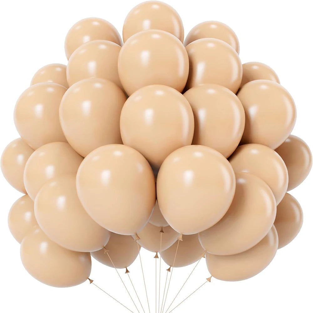 A bunch of pastel latex balloons in shades of beige and cream, tied together.