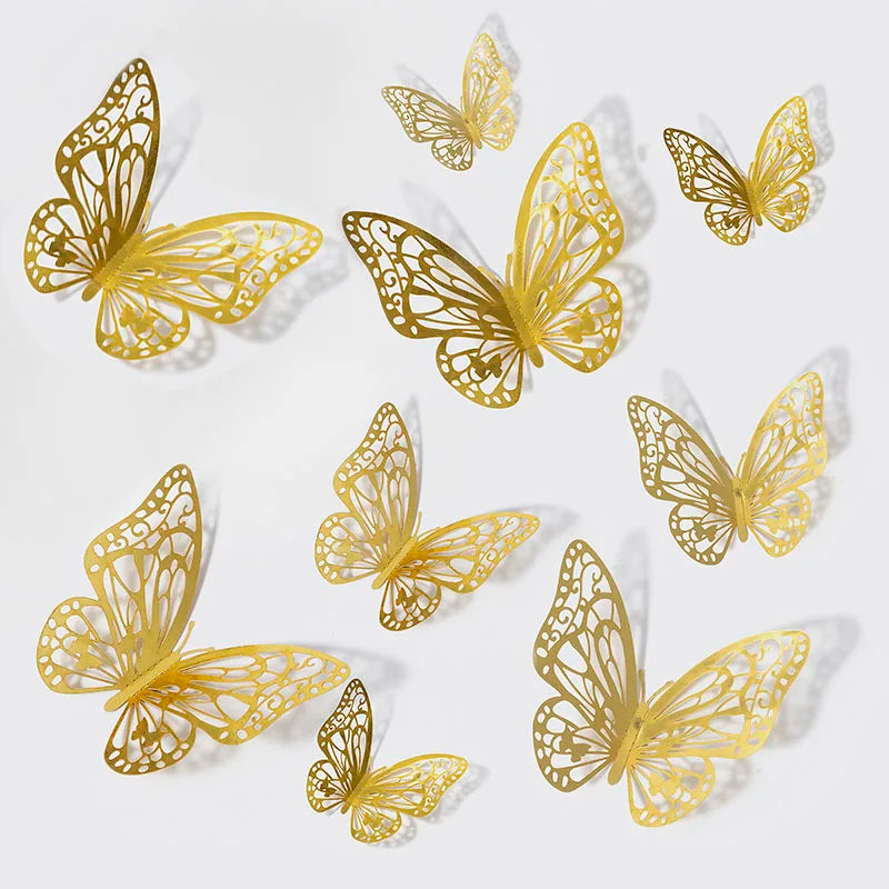 A collection of gold metallic 3D butterfly wall stickers in various sizes and orientations.