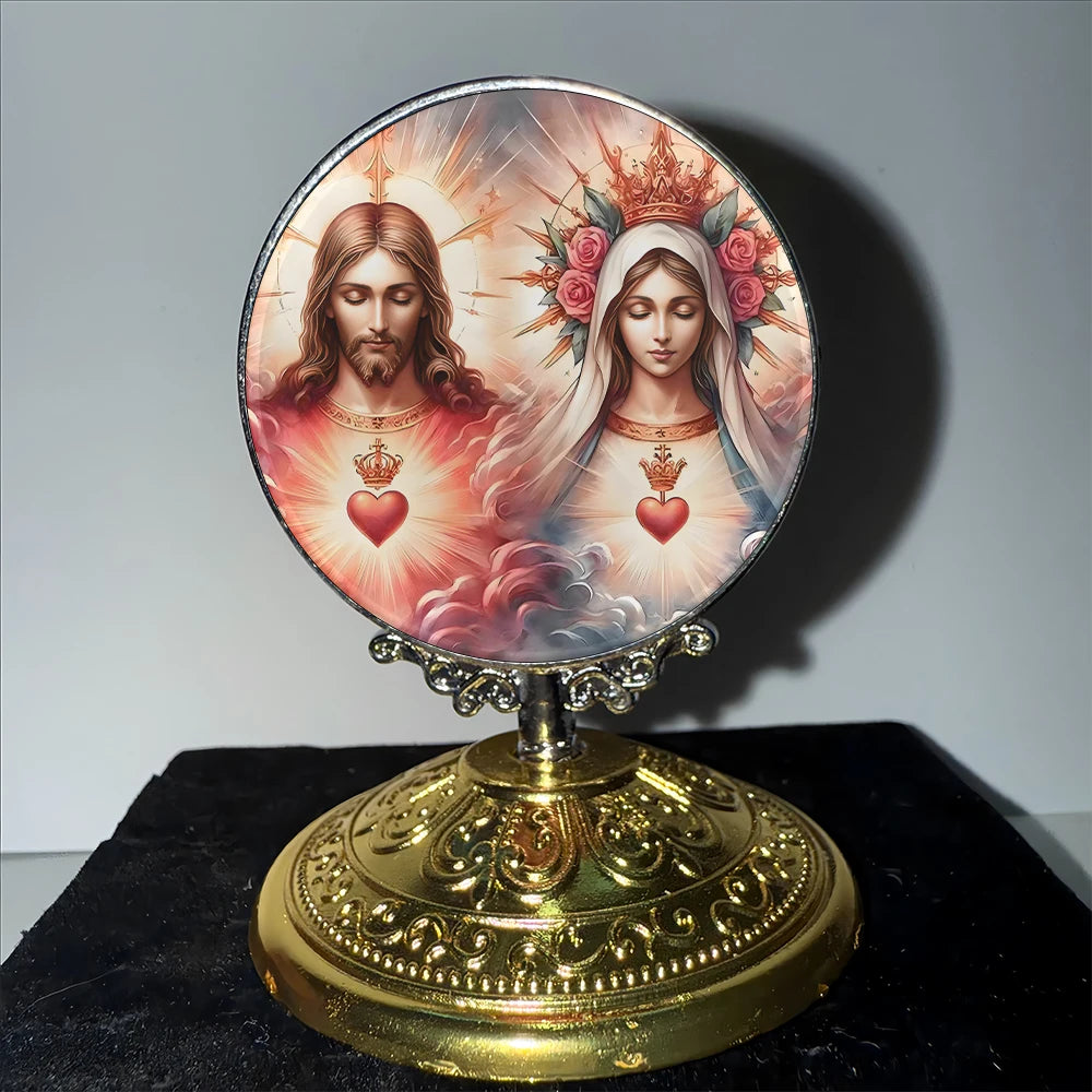 A round silver ornament featuring a depiction of Jesus and the Virgin Mary with halos and floral wreaths.