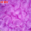 A close-up of vibrant purple silk rose petals used for weddings and events.