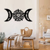 Black metal wall art featuring a pentagram design with crescent moon shapes on a white wall.
