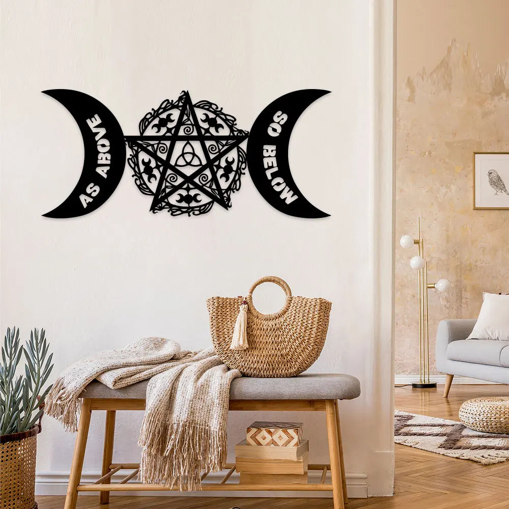 Black metal wall art featuring a pentagram design with crescent moon shapes on a white wall.