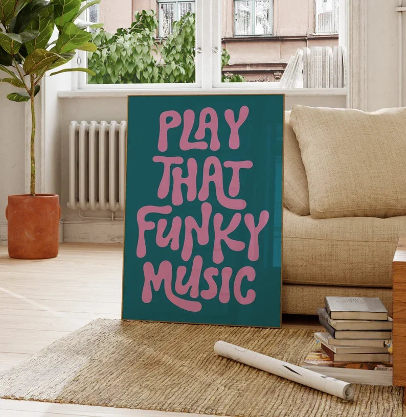 A teal canvas art poster featuring pink text that reads Play That Funky Music, displayed in a bright room.