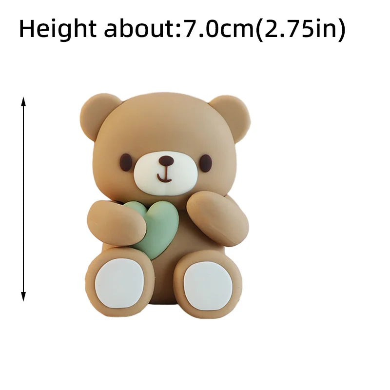 A light brown cartoon teddy bear figure with a green heart detail, shown from the side.