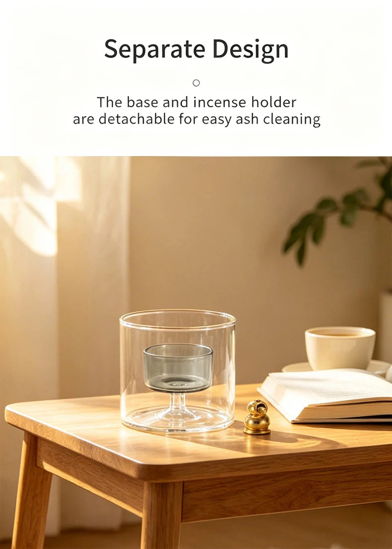 A clear glass incense burner with a gourd shape and a removable base sitting on a wooden table.