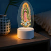 Lumière de nuit décorative rétro avec un ovale de verre translucide représentant la Vierge Marie et un chérubin.
