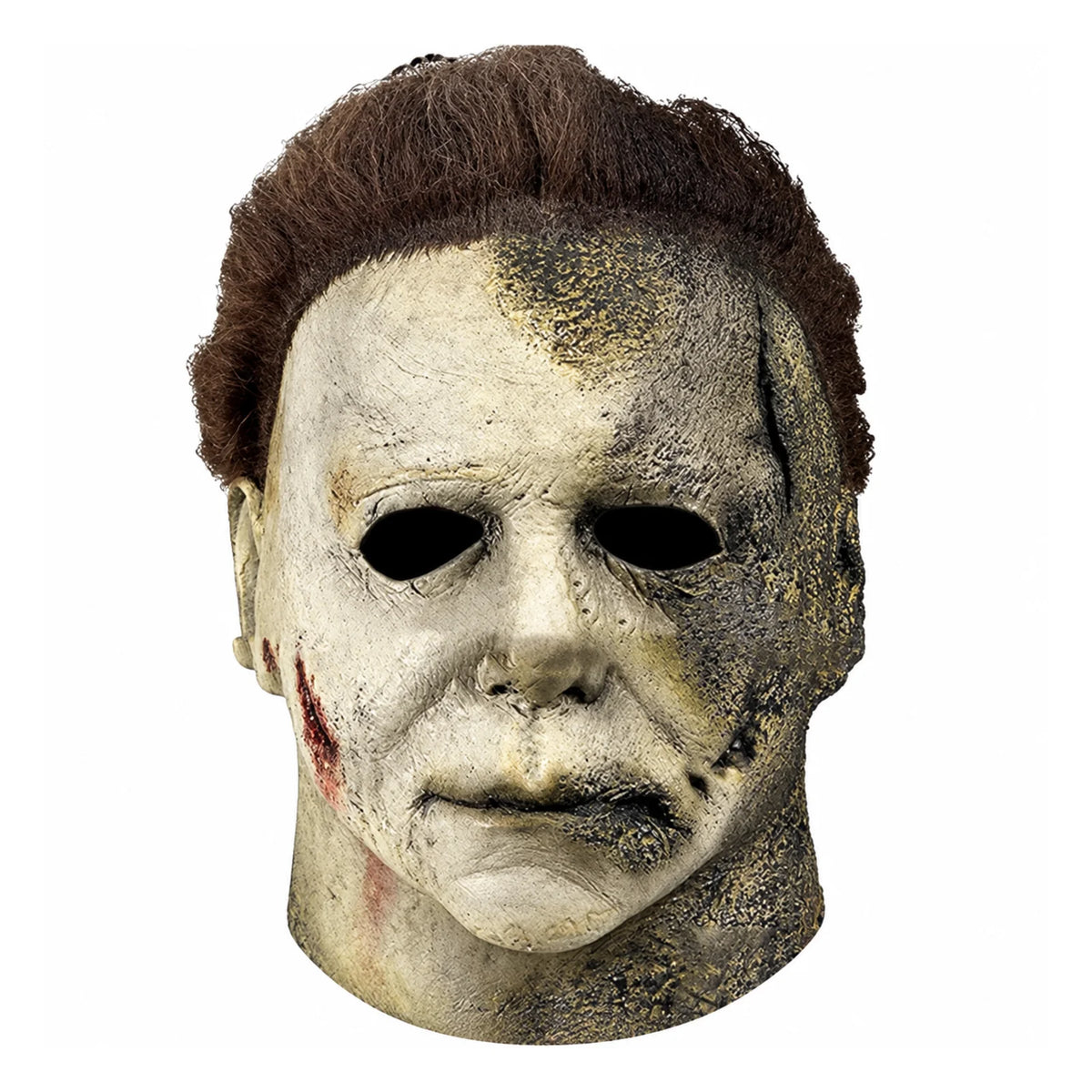 A close-up of a Halloween Michael Myers latex mask with a bloody scar detail on the face.
