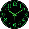 A black analog clock face with bright green hour and minute markings.