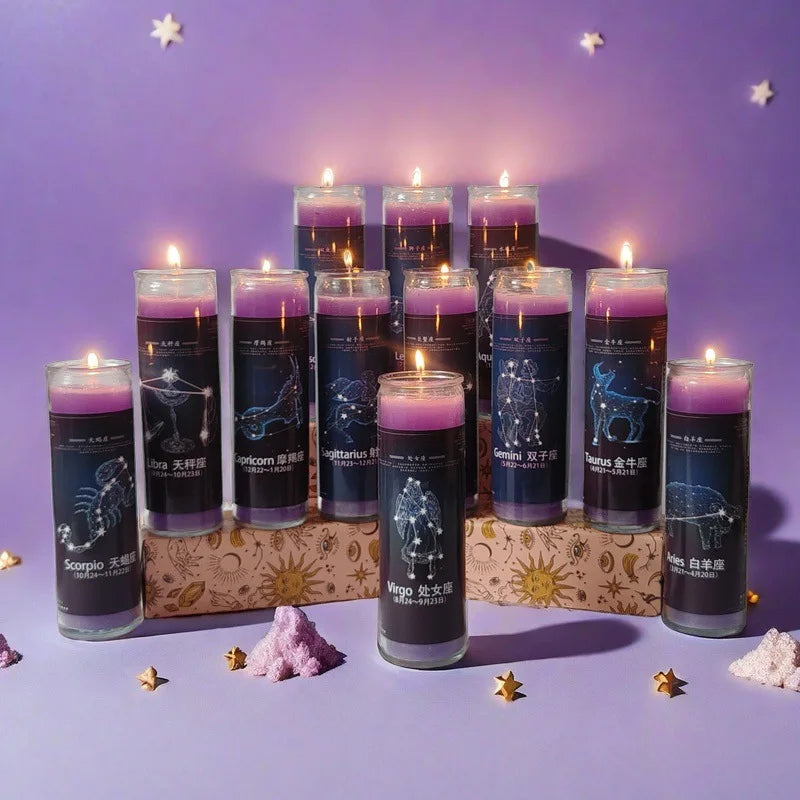 A collection of twelve dark blue glass candles featuring zodiac signs, set against a purple background.