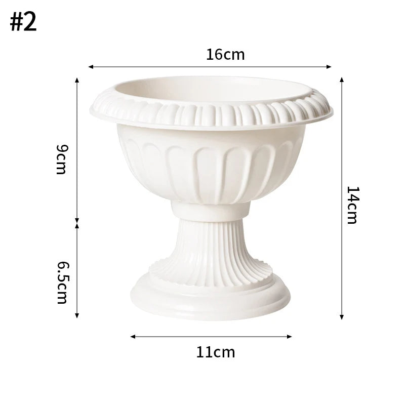 A white plastic decorative vase with a wide bowl, pedestal base, and ruffled rim.