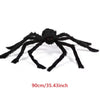 A large, black plush spider decoration with eight legs is shown against a white background.