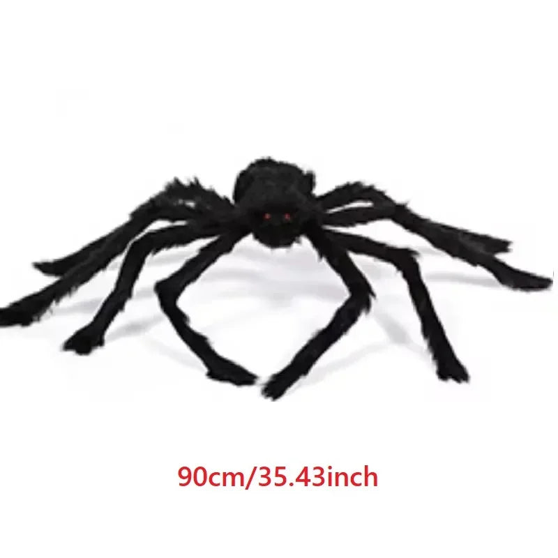 A large, black plush spider decoration with eight legs is shown against a white background.