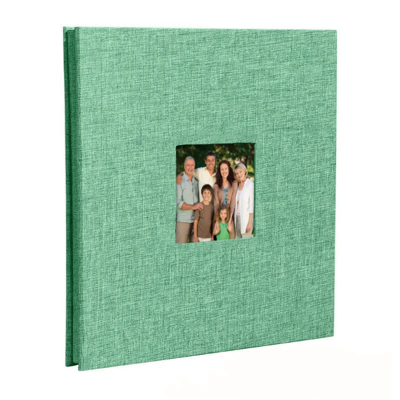 A green linen front scrapbook memory book with a photo of a family.