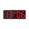 A black LED digital alarm clock displaying the time 13:06 with a red backlight.