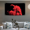 A red silhouette of a woman's face and body against a black background on a canvas tapestry