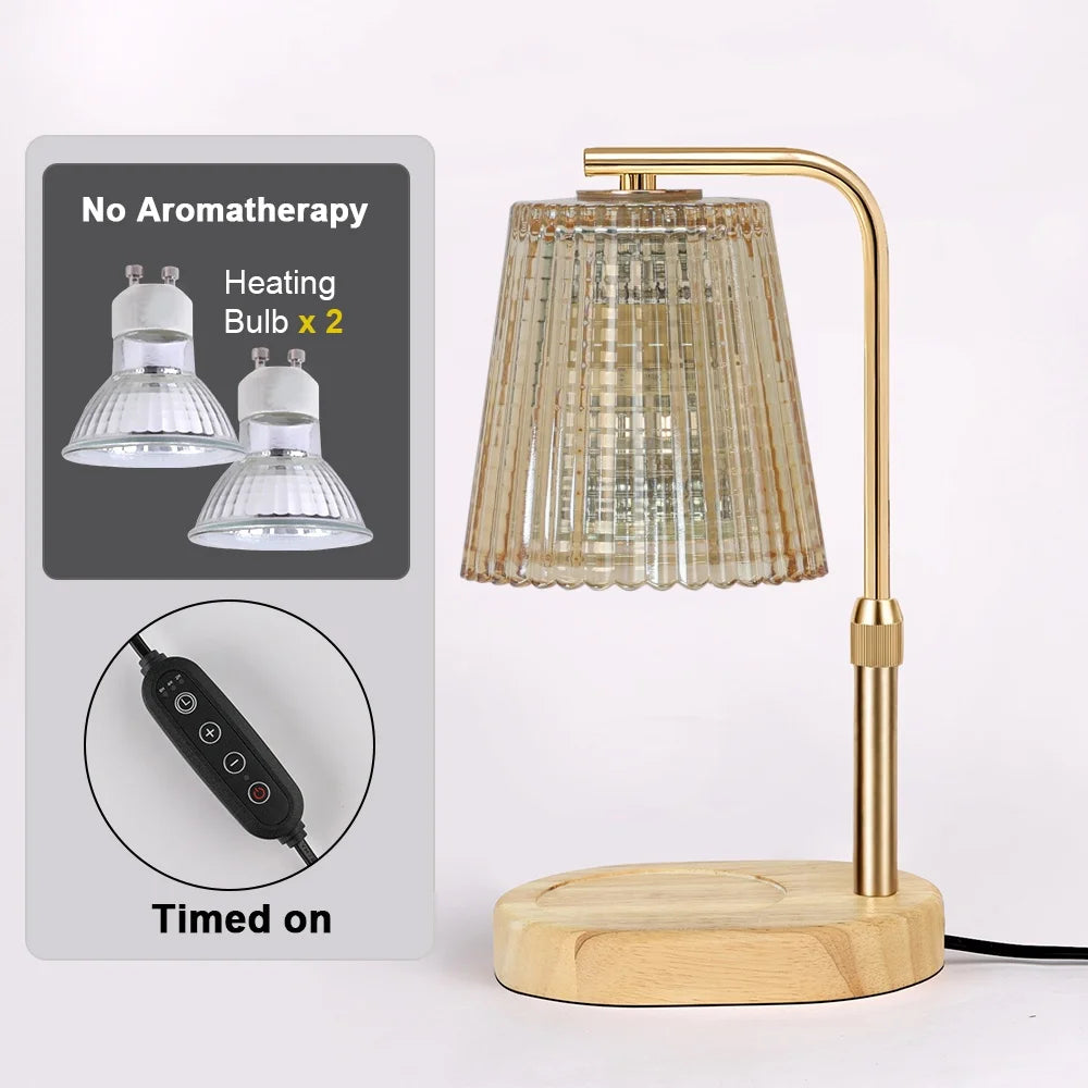A brass adjustable electric candle warmer lamp with a clear glass shade and wooden base, shown next to instructions.