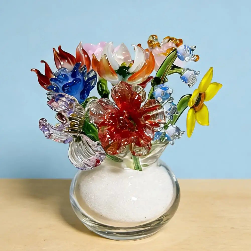 Handcrafted blue glass flower sculpture featuring various colored glass petals in a clear vase