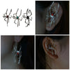 Silver spider ear cuffs with red eyes for cosplay and fashion