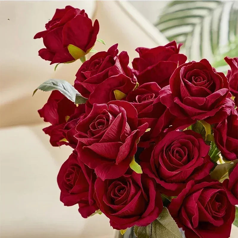 A bouquet of deep red velvet artificial roses for weddings and home décor.