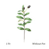 Artificial olive tree branch with green leaves and dark berries without a pot