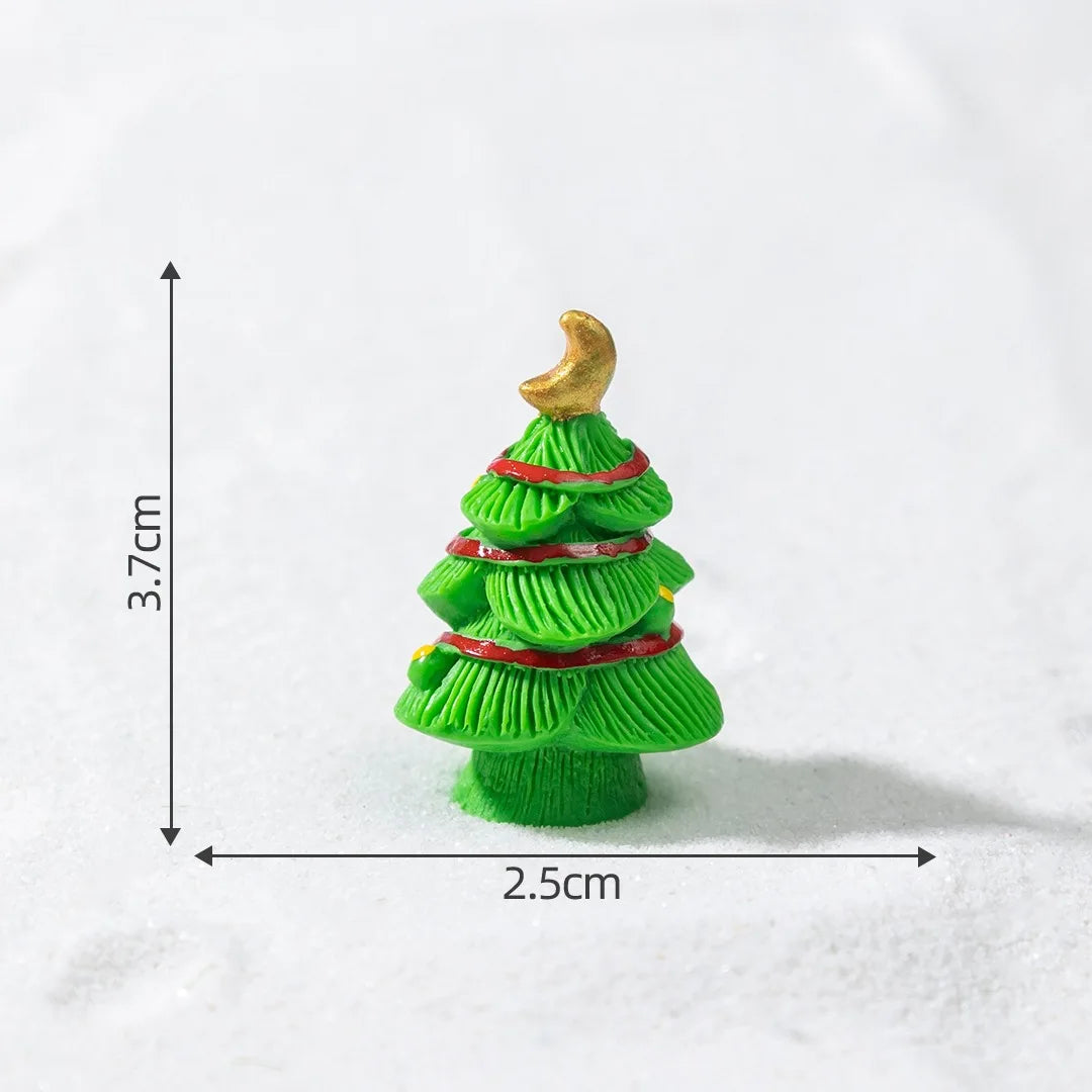 A small green resin Christmas tree charm with a gold star topper, shown against a white background.