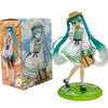 A PVC collectible figurine of Hatsune Miku in a green and white outfit with long teal hair, standing on a green base.