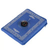 A blue portable travel prayer mat with a compass design, featuring intricate patterns and a zippered closure.