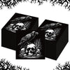 A set of black paper napkins featuring designs of skulls and spiders.
