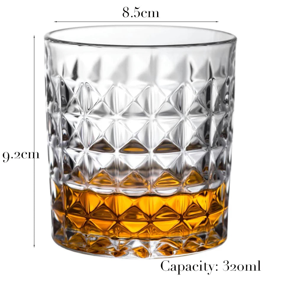 A clear, faceted whiskey glass with a heavy base and a capacity of 32ozml.