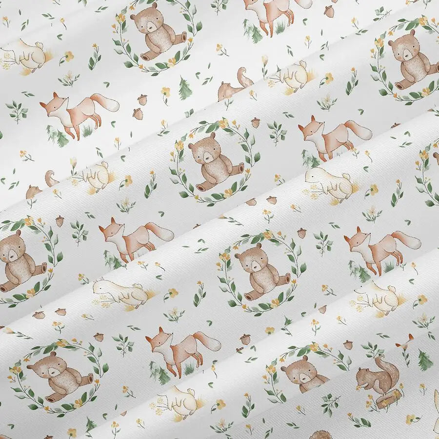 Light gray fabric with an all-over floral print featuring cute woodland animals like bears and rabbits.