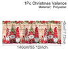 Festive Christmas valance featuring Santa figures and greenery made of polyester.