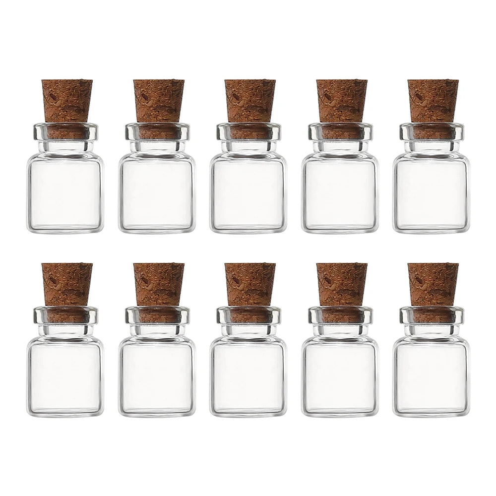A set of decorative glass vials with cork stoppers, featuring clear glass and natural cork tops.