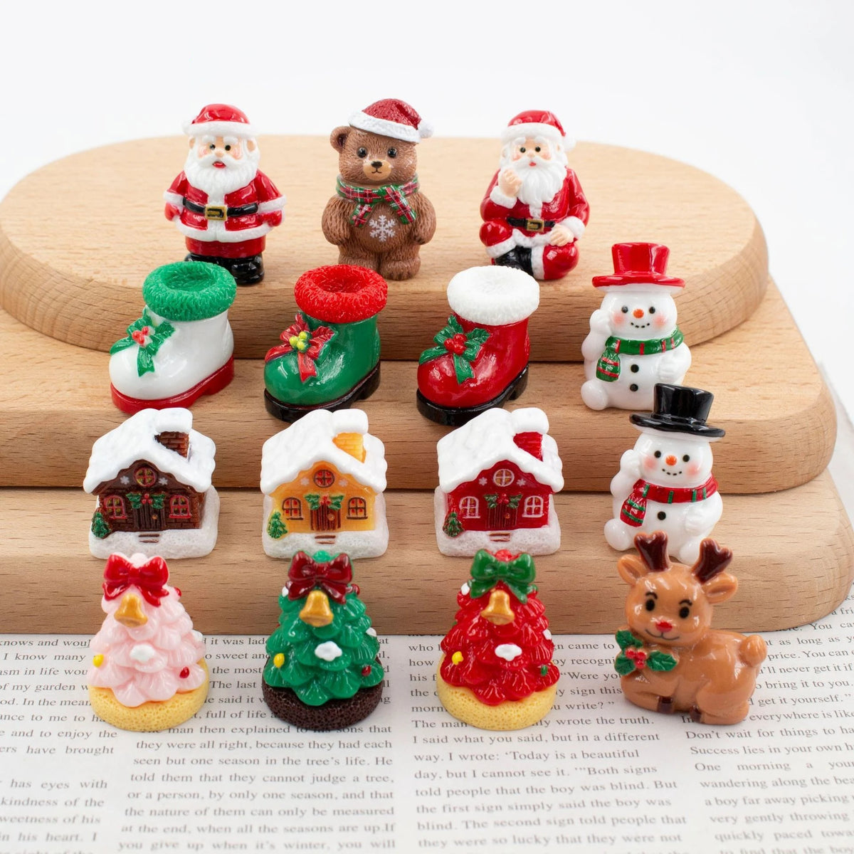 A set of festive Christmas resin decor featuring Santa figures, reindeer, and miniature houses.
