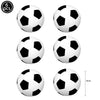 A set of six black and white soccer balls for a birthday party cake topper.