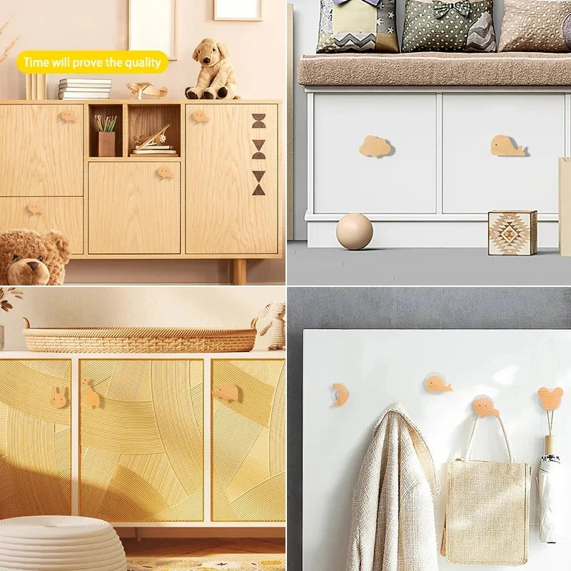 Decorative wooden animal hooks in natural wood tones displayed on kitchen and storage cabinets.