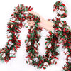 A hand is holding a festive Christmas tinsel garland decorated with reindeer and snowmen faces.