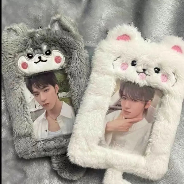 A cute plush photocard holder with a zipper closure featuring two male figures inside.