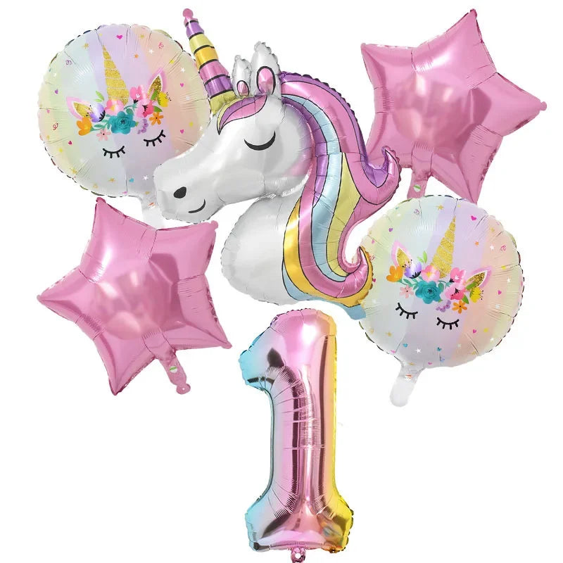 A collection of pink and iridescent balloons, including a unicorn balloon and a large pink star balloon.