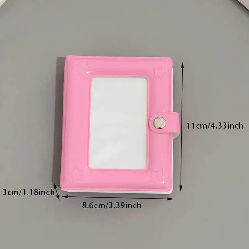 A pink mini photo card binder with a clear plastic cover and a snap closure.