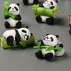 A set of mini resin panda bonsai figurines featuring pandas holding bamboo leaves.