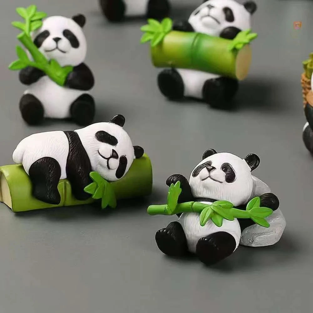 A set of mini resin panda bonsai figurines featuring pandas holding bamboo leaves.